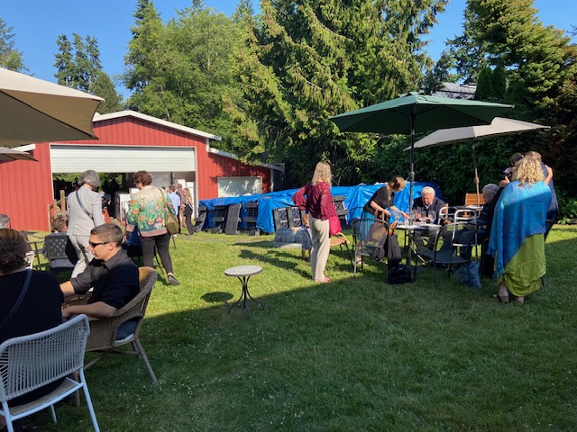 people enjoying wine outside at Rolling Bay Winery